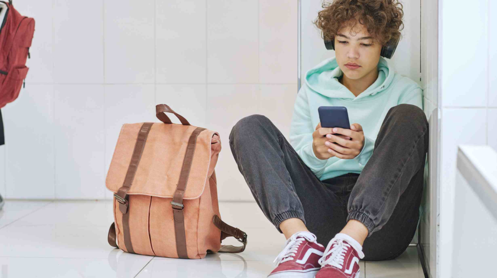 boy looking at his phone