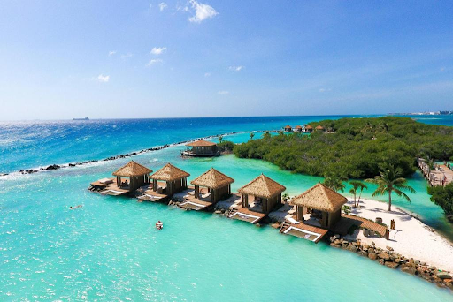 Embark on a Luxurious Escape: Your Invitation to Renaissance Aruba’s Flamingo Beach Cabanas.