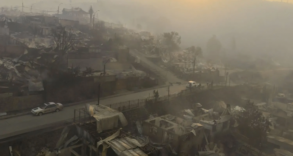 Massive forest fire with thick smoke plumes in the Biobío region of Chile.